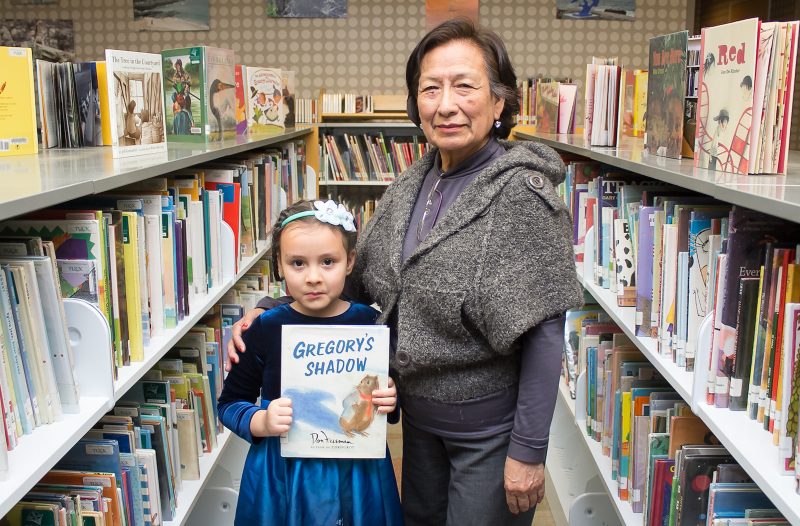 grandmother and granddaughter at library